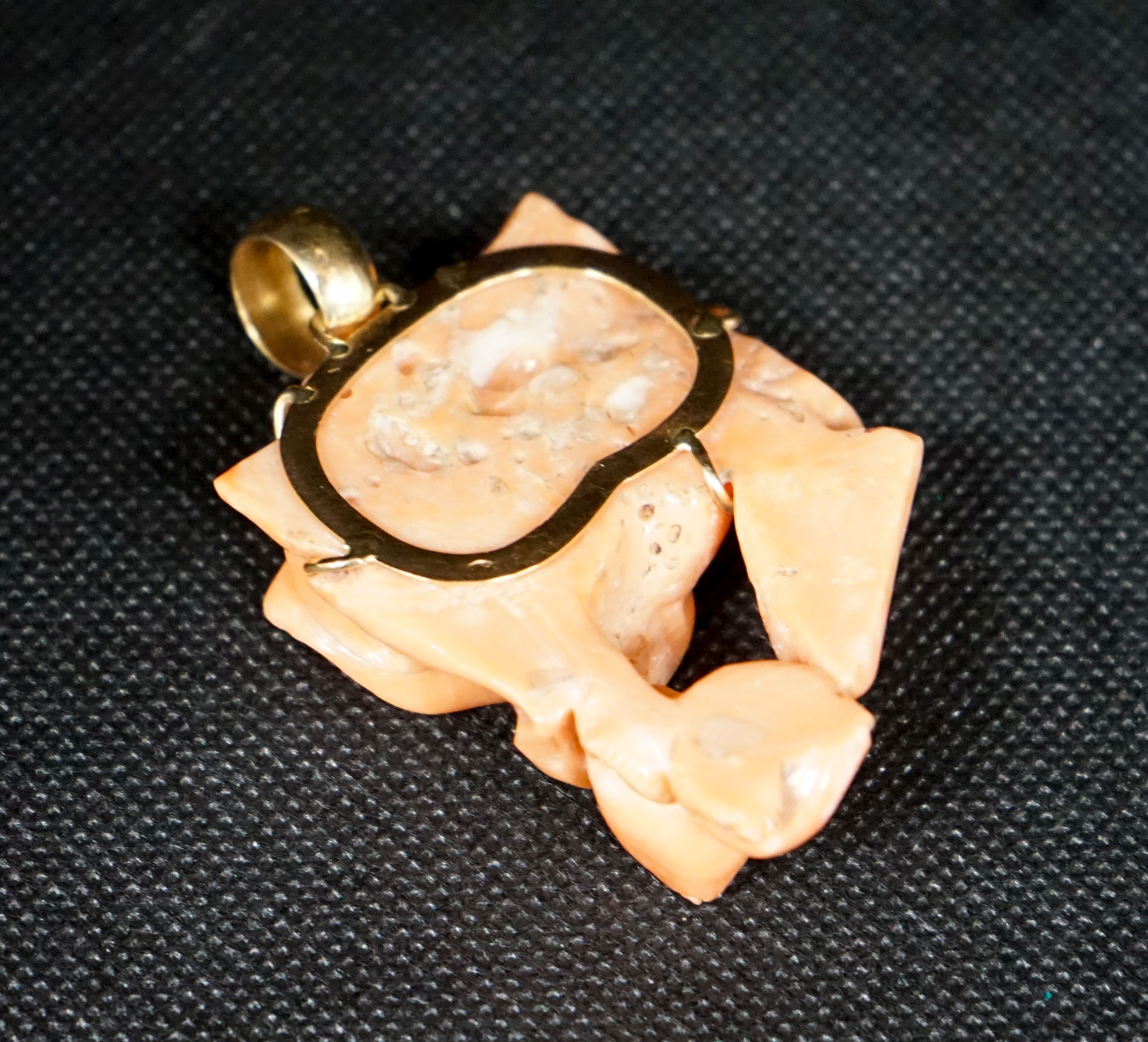 A yellow metal mounted carved coral 'rose' pendant, 49mm, gross weight 40 grams.